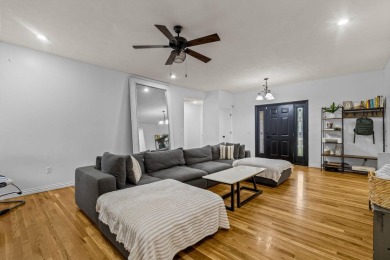 This gorgeous 3 bed, 2 bath, all-brick home with a three-car