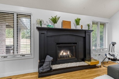 This gorgeous 3 bed, 2 bath, all-brick home with a three-car