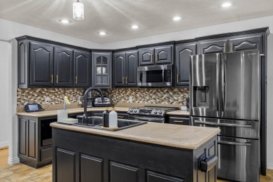 This gorgeous 3 bed, 2 bath, all-brick home with a three-car