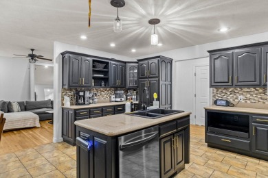 This gorgeous 3 bed, 2 bath, all-brick home with a three-car