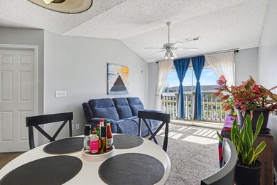 This 3-bedroom, 2-bathroom condo features a bright living room - photo 3