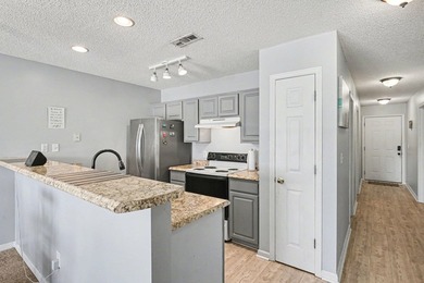 This 3-bedroom, 2-bathroom condo features a bright living room - photo 5