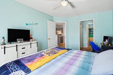 This 3-bedroom, 2-bathroom condo features a bright living room - photo 9