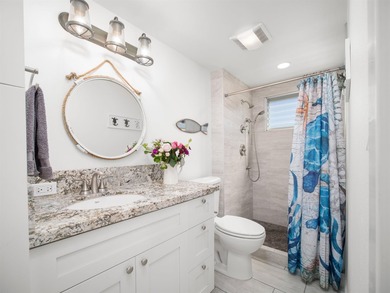 Beautiful and fully remodeled end unit that sits south of the - photo 7