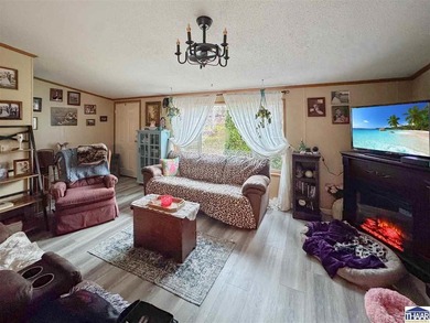 Nestled at the end of a quiet lane on 2 private acres, this