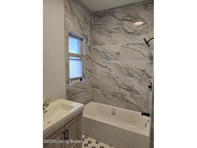 Experience the ultimate in city living with this meticulously - photo 6