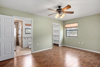 Well maintained 4-bedroom, 3-bath single-level home on 1.85