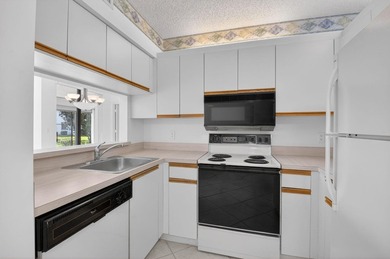 Enjoy tranquil lake views from this first-floor 3-bedroom - photo 9