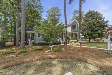 Located in Reynolds Landing, this lakeview home offers access to - photo 46