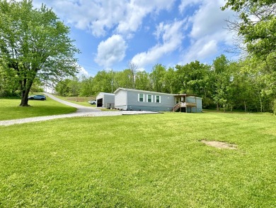 Discover your slice of paradise with this remarkable property - Lake Home For Sale in Somerset, Kentucky