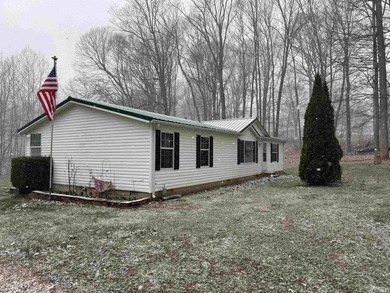 Nestled at the end of a quiet lane on 2 private acres, this