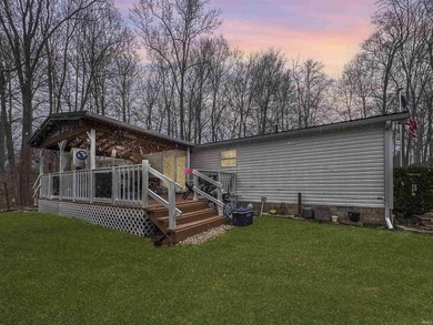 Nestled at the end of a quiet lane on 2 private acres, this