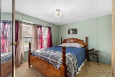 Tucked into a quiet waterfront community, this well-kept home - photo 12