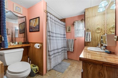 Tucked into a quiet waterfront community, this well-kept home - photo 16