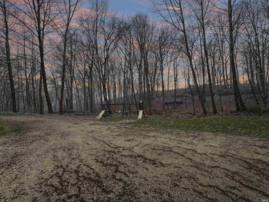 Nestled at the end of a quiet lane on 2 private acres, this