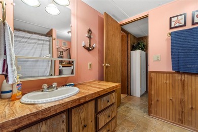 Tucked into a quiet waterfront community, this well-kept home - photo 20