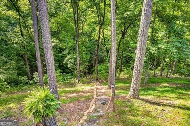 Fully furnished true log home on 5.78 private wooded acres in - photo 45