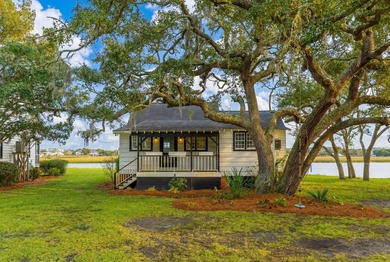 Tucked beneath a canopy of majestic live oaks along the serene - photo 2