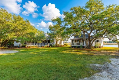 Tucked beneath a canopy of majestic live oaks along the serene - photo 4