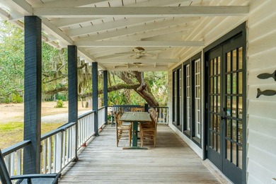 Tucked beneath a canopy of majestic live oaks along the serene - photo 8