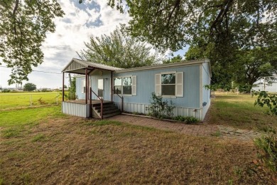 Welcome to 207 Lazy B Lane in Springtown TX. This well laid