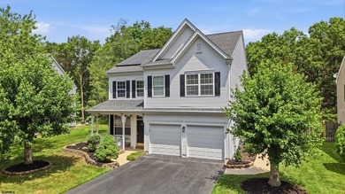 This stunning two-story single-family home is nestled in the - photo 1