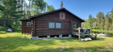 This 80-acre boat access family hunting & fishing camp known as - Lake Home For Sale in Crane Lake, Minnesota