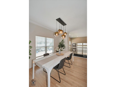 Step into three levels of light-filled living in this - photo 10