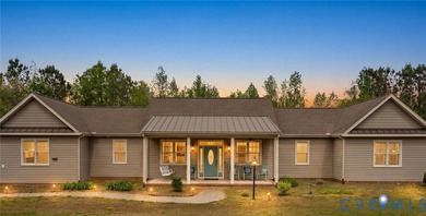 Custom-built and situated on 3.42 private wooded acres, this - photo 1