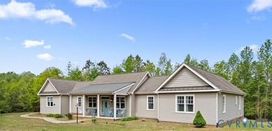 Custom-built and situated on 3.42 private wooded acres, this - photo 2