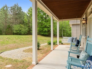 Custom-built and situated on 3.42 private wooded acres, this - photo 3