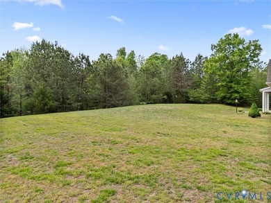 Custom-built and situated on 3.42 private wooded acres, this - photo 4