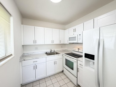 Welcome to this spacious 2 bedroom, 1-bath condo located on the - photo 3