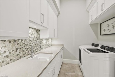 This coastal-inspired estate, built by Braun Builders, offers 5