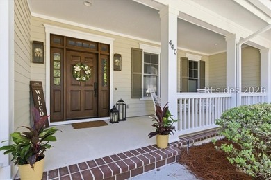 Hampton Lake is a gated community in Bluffton, centered around a - photo 3