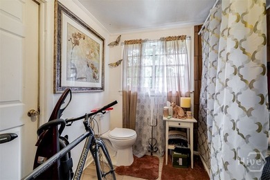 This 1950s ranch bungalow offers four bedrooms and two full - photo 15