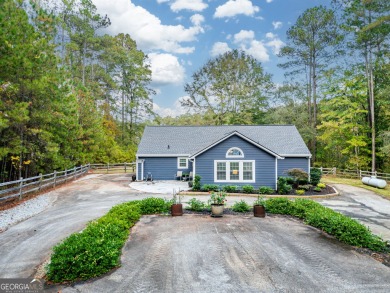 This adorable 3 BR/2 BA Ranch, private lake-side retreat is - Lake Home For Sale in Sparta, Georgia