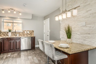 Exceptional first-floor 2-bedroom, 1-bath condo offering one of - photo 7