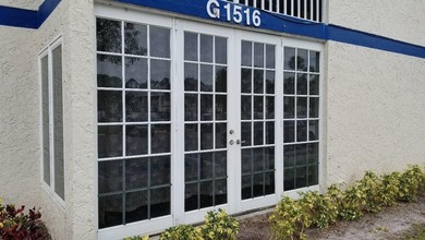 This updated ground floor unit features closed in porch; - photo 19