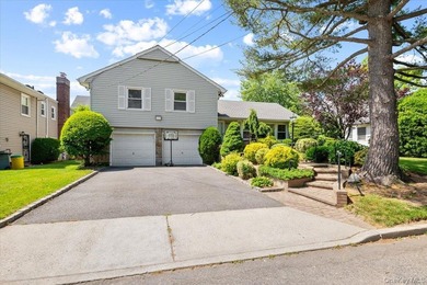 Nestled on a quiet, tree-lined block in the heart of Woodmere - photo 1