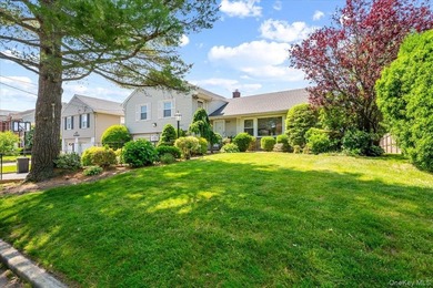 Nestled on a quiet, tree-lined block in the heart of Woodmere - photo 2
