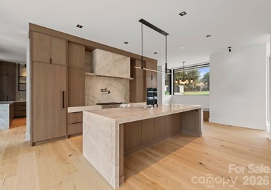 Private by design. Defined by the lake. Behind private gates and - photo 11