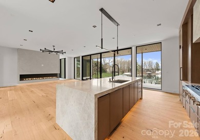 Private by design. Defined by the lake. Behind private gates and - photo 12
