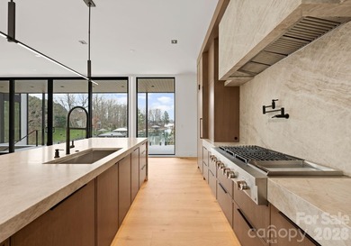 Private by design. Defined by the lake. Behind private gates and - photo 13