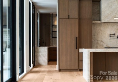 Private by design. Defined by the lake. Behind private gates and - photo 14