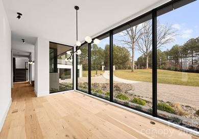 Private by design. Defined by the lake. Behind private gates and - photo 17