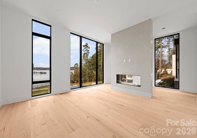 Private by design. Defined by the lake. Behind private gates and - photo 20