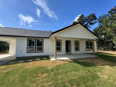 New construction on a wooded 0.65-acre lot in Lakewood Shores at - photo 1