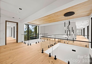Private by design. Defined by the lake. Behind private gates and - photo 30