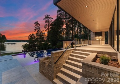 Private by design. Defined by the lake. Behind private gates and - photo 46